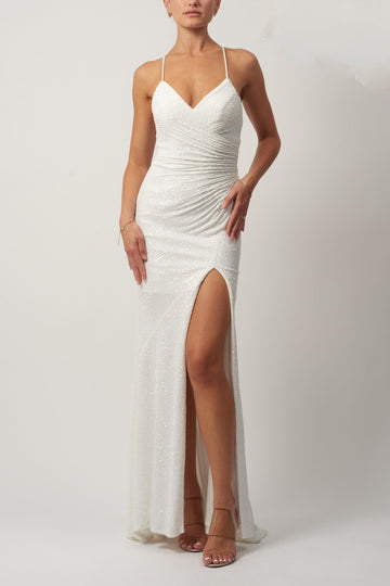 model wearing a long white sequinned dress