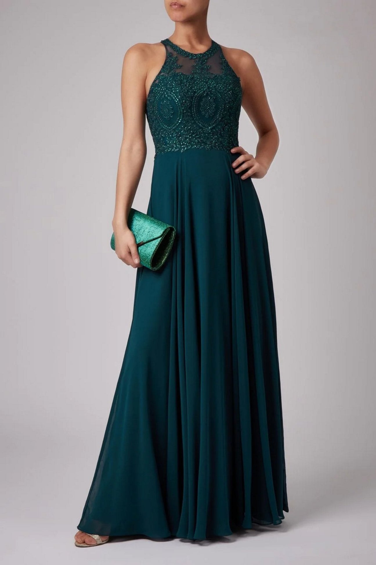 Young female standing in a Bottle Green Double lace strap dress