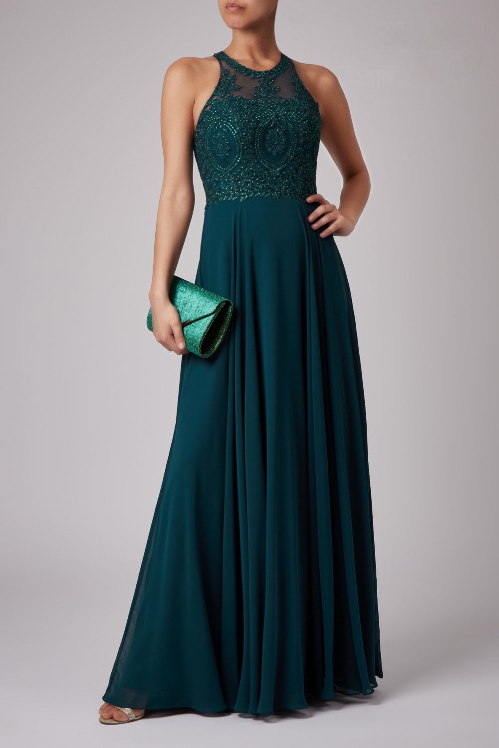 Young female standing in a Bottle Green Double lace strap dress