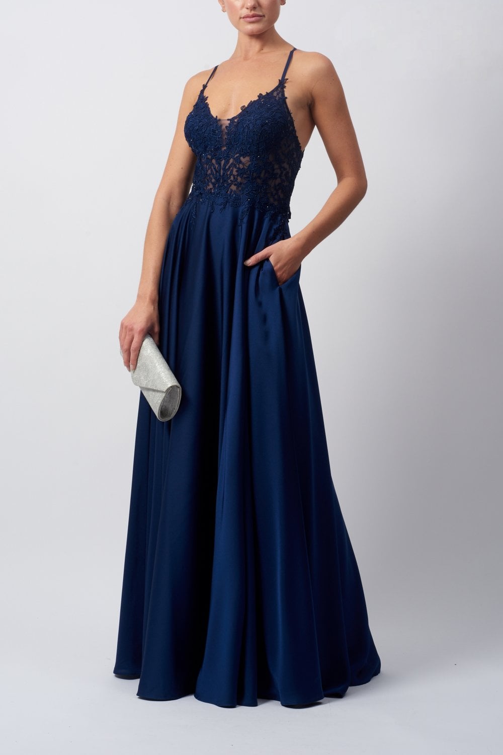 Young female standing in a Navy Satin Low Back Dress